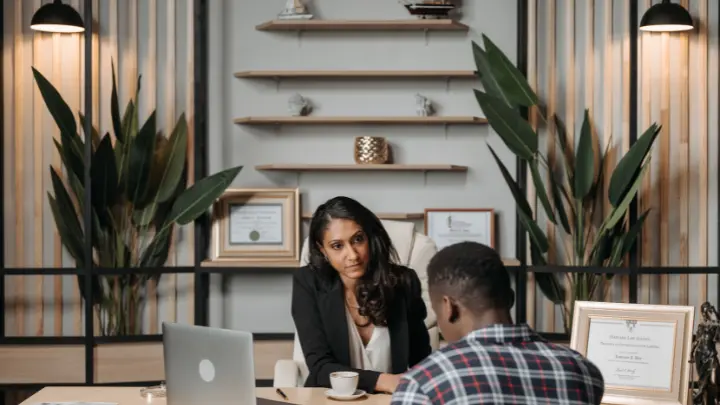 A lawyer speaking with a client.