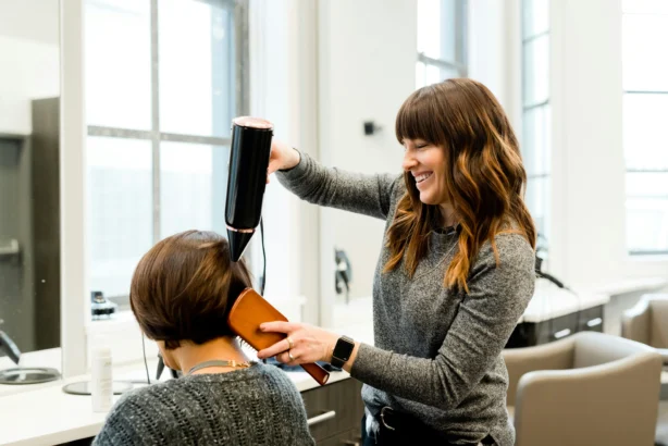 Small business hairdresser doing hair.