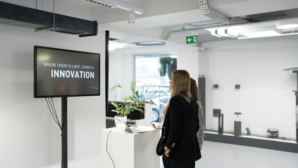 Businesswomen Discussing Innovation in Modern Office